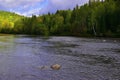 Small fast rifts on the Ural mountain river Usva in the area of the Stolby stone