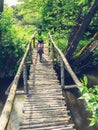 Small fearless biker crossing wooden bridge Royalty Free Stock Photo