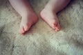 Small feet of a newborn baby on a light background Royalty Free Stock Photo