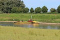 Small ferry boat crossing the river ijssel