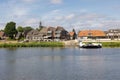 Small ferry crossing river Meuse near Dutch village Broekhuizen