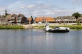 Small ferry crossing river Meuse near Dutch village Broekhuizen