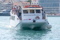 Small ferry approaching harbor Royalty Free Stock Photo