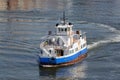 Small ferry with passengers crossing river Tyne in Newcastle harbor