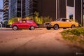 Small Fiat and Torino Coupe in the street. Royalty Free Stock Photo