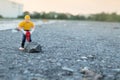 Small figure of a man digging concrete road