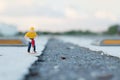 Small figure of a man digging street