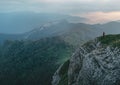 Small figure of man in mountains.