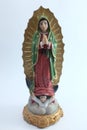 Small Figure Statue of Blessed Virgin Mary in Roman Catholic Church on white background. Royalty Free Stock Photo