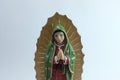 Small Figure Statue of Blessed Virgin Mary in Roman Catholic Church on white background. Royalty Free Stock Photo