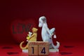 Small figurine of a cat and a dog congratulate each other on Valentine\'s Day Royalty Free Stock Photo