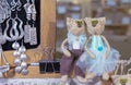 Small figurines of cats in a street souvenir shop