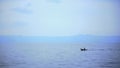 A small fisherman boat is sailing in Toba Lake, North Sumatra, Indonesia. Royalty Free Stock Photo