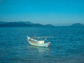 A small fishing boat is anchored near the shore Royalty Free Stock Photo