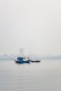 The small fishing boat is anchored. Stop back from Fishing near the coast Royalty Free Stock Photo