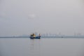 The small fishing boat is anchored. Stop back from Fishing near the coast Royalty Free Stock Photo