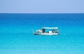 Small fishing boat in a calm blue sea Royalty Free Stock Photo