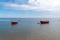 Small fishing boat on calm sea low tide in noirmoutier Royalty Free Stock Photo