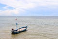 Fishing boat in the cloundy sea