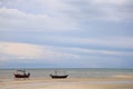 Fishing boat in the cloundy sea