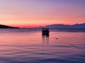 Small Fishing Boat in Corinthian Gulf Bay at Dawn, Greece Royalty Free Stock Photo