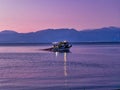 Small Fishing Boat in Corinthian Gulf Bay at Dawn, Greece Royalty Free Stock Photo