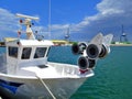 Small fishing boat docked in harbor Royalty Free Stock Photo