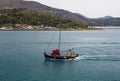 Small fishing boat heading out for the days catch. Royalty Free Stock Photo