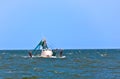 Small fishing boat heading out to the ocean Royalty Free Stock Photo