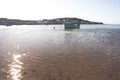 Small fishing boat moored in the estuary river at low tide