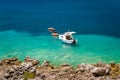 Small fishing boat moored at paradise bay shore Royalty Free Stock Photo