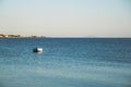 Small fishing boat moored on a sea