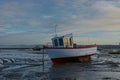 Small fishing boat on mudflats. Fragile eco-system Royalty Free Stock Photo