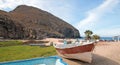 Small fishing boat / ponga at Punta Lobos beach on the coast of Baja California Mexico Royalty Free Stock Photo