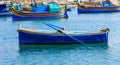 Small fishing boat at the port of Marsaxlokk, Malta. Closeup view Royalty Free Stock Photo