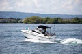 A small fishing boat returns to the Collingwood Harbor Royalty Free Stock Photo