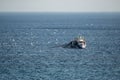 Small fishing boat sailing in an open Mediterranean sea, close-up. Royalty Free Stock Photo