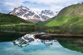 Small fishing boat in scenic fjord on Lofoten, Royalty Free Stock Photo