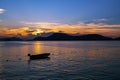 Small fishing boat in the sea sunset scenery, Beautiful Landscape and light of nature in evening with beautiful colors Clouds and Royalty Free Stock Photo