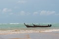 Small fishing boat in a storm near beach Royalty Free Stock Photo