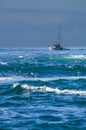 Small fishing boat with surf Royalty Free Stock Photo