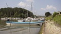 Fishing Boats Anchored at Rivers Shore Royalty Free Stock Photo