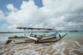 small fishing boats leaning over the edge on the beach