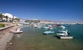 Small fishing boats and yachts moored in Roquets del Mar port or