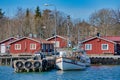 Small fishing harbor of Grisslehamn during a clear spring day