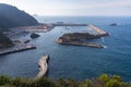 Small fishing harbor in the North of Spain, by the Atlantic ocean. Hidden natural harbor surrounded by hills. Tourism and fishing
