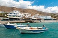 Small fishing motorboats in blues lagoon of Chora Sfakion town, Crete island, Greece.