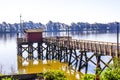 Small Fishing Pier On River Shore Royalty Free Stock Photo