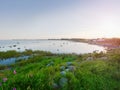 Small fishing port with boats anchored and moored on sea bay in Sweden. Built stony dam, Royalty Free Stock Photo