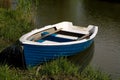 Small fishing rowboat floating